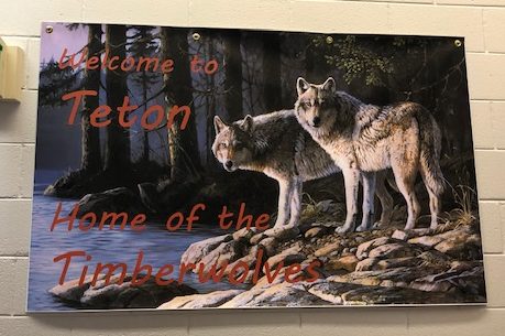 A banner displaying Teton High Schools new Timberwolf mascot and nickname. The Timberwolf mascot was approved in June of 2020, replacing the schools Redskin mascot. 
