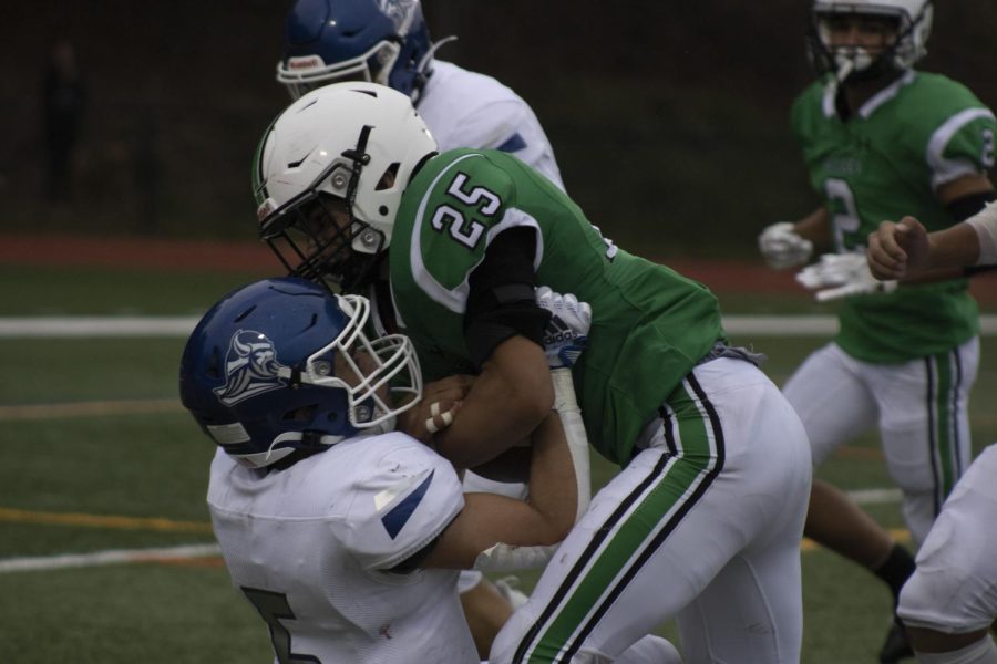 Kevin Regula runs through a Northern-Valley Demarest defender during the 2022 season. He looks to lead Pascack Valley to a successful season this year. 