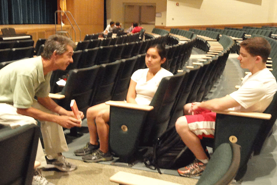 From left to right, Dr. Mike Faigle, freshman Emily Le, and junior Justin Luwbel discuss Catcher in the Rye during book discussions last Wednesday.