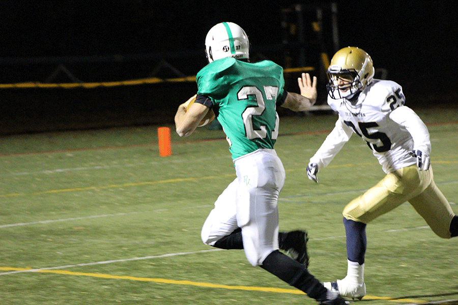 Jorge+Cortes+stiff+arms+his+way+for+a+touchdown+in+the+fourth+quarter%2C+as+Pascack+Valley+defeated+Old+Tappan+37-14.