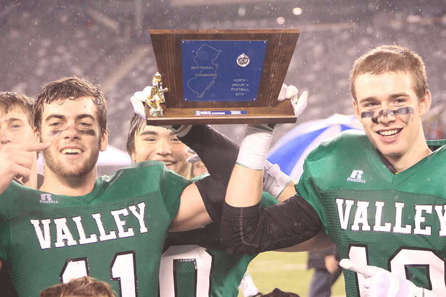 Seniors+Greg+Collier%2C+left%2C+and+Steve+Farrell+hoist+the+trophy+after+Pascack+Valley+downed+Paramus+22-6+to+win+its+second+straight+North+1%2C+Group+4+title+Saturday+at+MetLife+Stadium.
