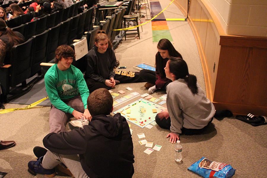 Students who refused taking the PARCC play monopoly to pass the time in the auditorium on Wednesday.