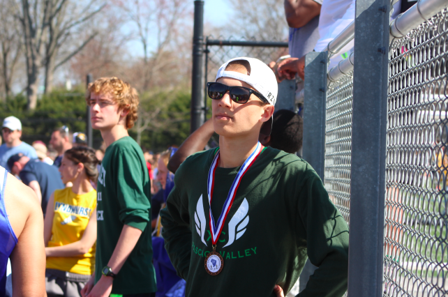 Junior Evan Jones relaxes after coming in second place in the Distance Medley Relay. 