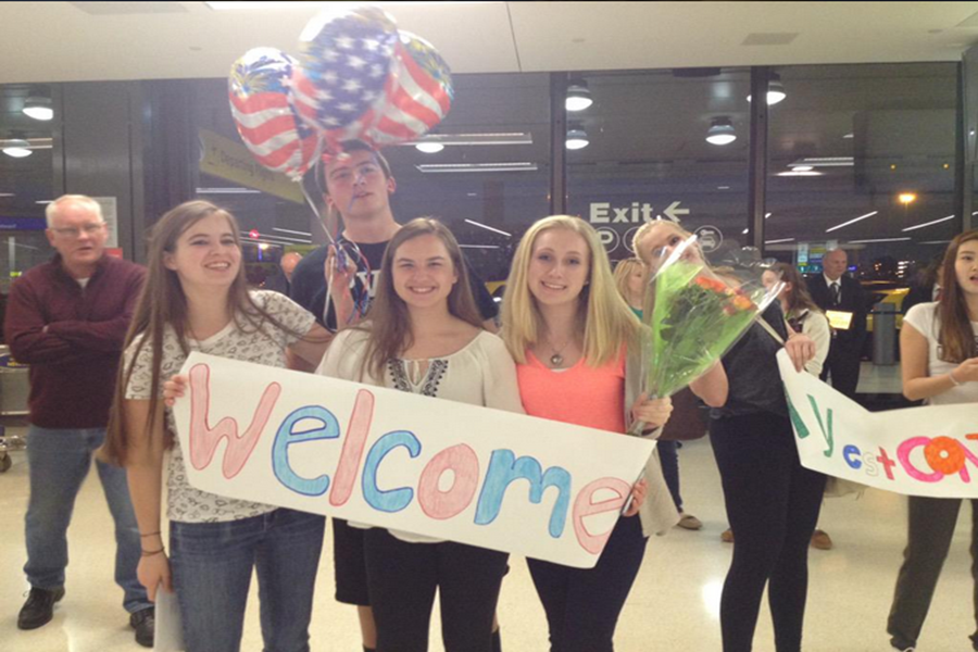From left to right, juniors Maggie Deegan, John Looes, Samantha Buldo, and Ashley Kasperavich wait at the airport for the French students to arrive.