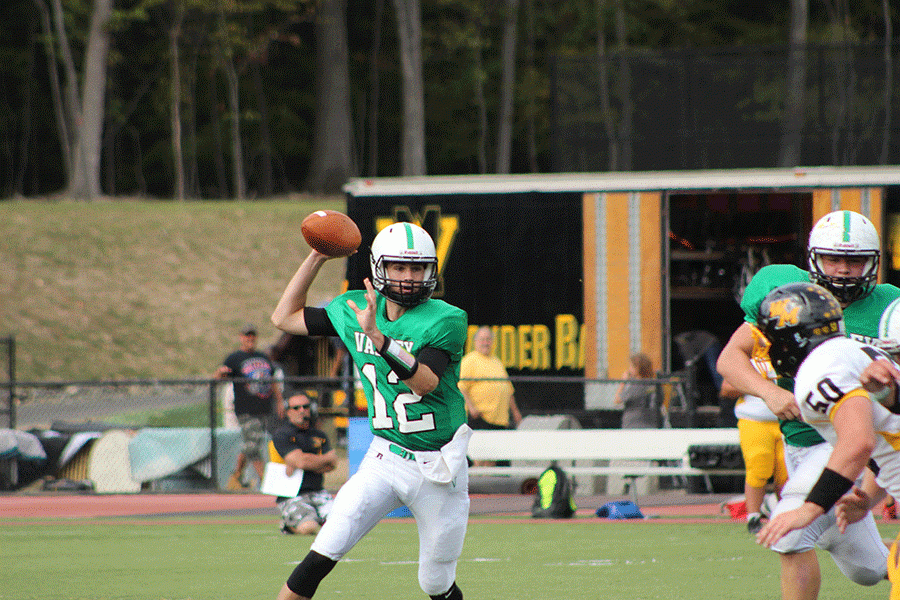 Quarterback Colin Dedrick on a pass attempt, one of the many he had during Saturdays win. 