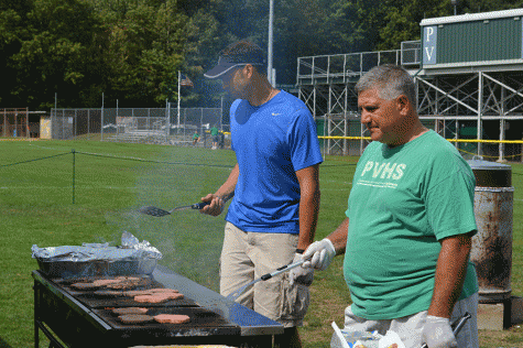 PV administrators Mr. John Puccio (left) and Mr. Tom DeMaio (right) grill at last years homecoming barbeque.