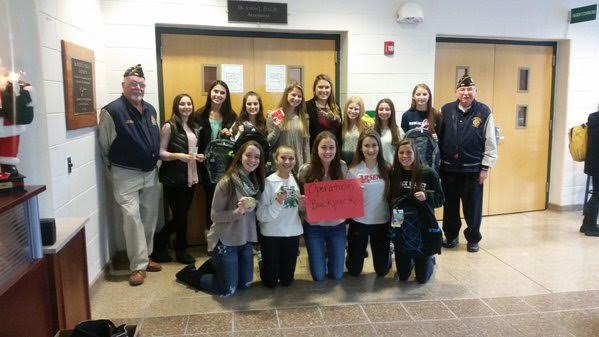 The sophomores that have participated pose with two veterans. 