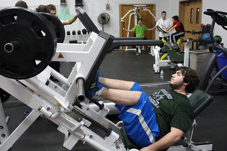 Defenseman Alex Sobel in the weight room, preparing for the season