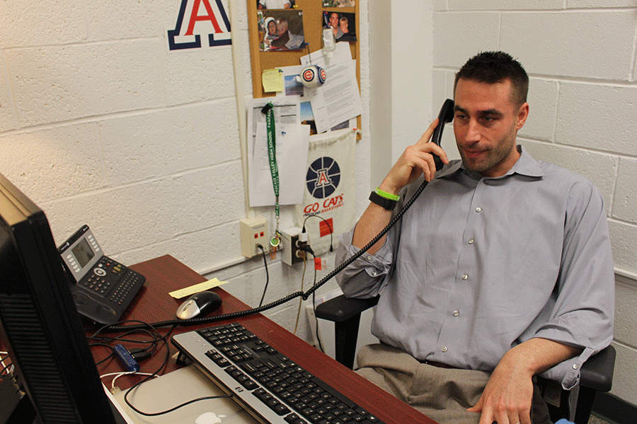 Dr. Steve Myers, one of PVs school psychologists, answers phone calls in his office.
