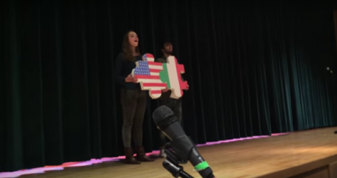 PV senior Laura Santo sings the Italian National Anthem on stage with one of the 24 Italian exchange students.