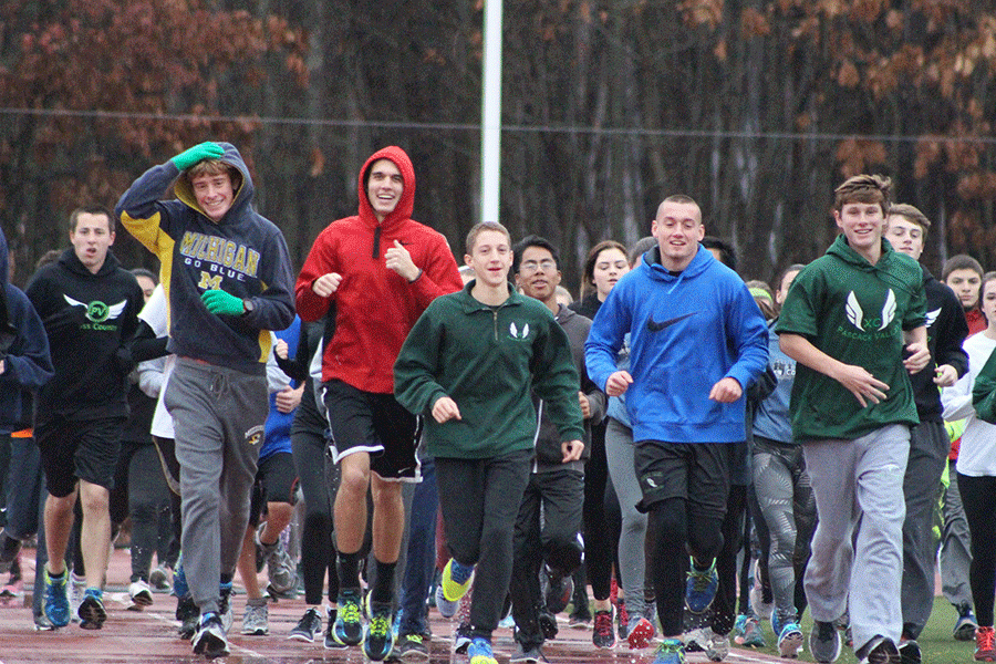 Winter track team members warm up before a practice