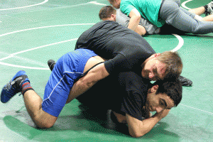 Casey Lewis, top, and Nicholas Timpanaro roll around during a recent PV wrestling practice.