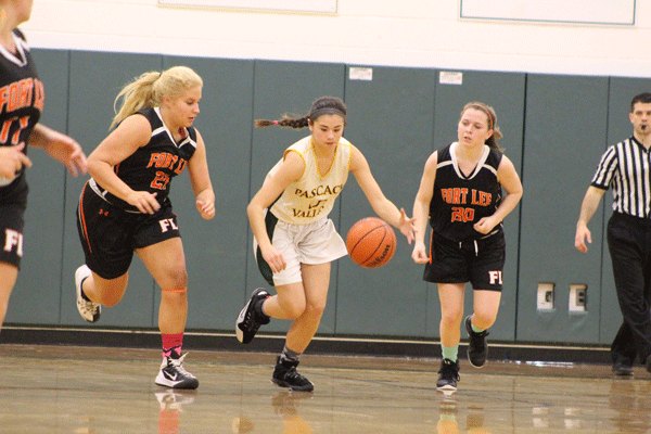 Sophomore Brianna Wong takes the ball up the court against Fort Lee Friday
