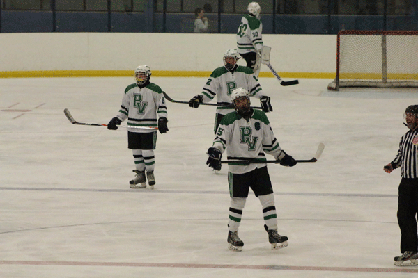 F Matt Truglio (15) , D James Robinson (12) , and F Alex Sullivan (6) on the ice against St.Joes during an 11-2 loss. Truglio contributed a goal.