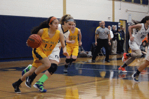 Sophomore Cerina Dunkel makes her way down the court in the team's opening game at Old Tappan