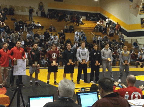 Sophomore Casey Lewis receiving his 5th place award for the 170 lb. division 
