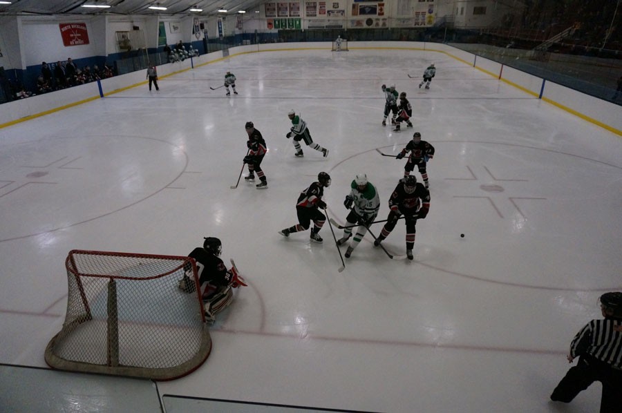 Leading goal scorer Matt Truglio (15) and other members of the team skating in the Indians usual venue – indoors at Sport-O-Rama.