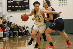 Senior Gina Criscuolo pushes past Old Tappan's Alexandra George