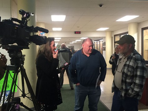 Fox 5 News conducts an interview with James Stankus (Center) during last years transgender policy hearings.
