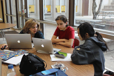 Non-tech mentor Mrs. Rein, (left) talks with PV junior Petar Miceviski and PV freshman Sarah Takubo. 