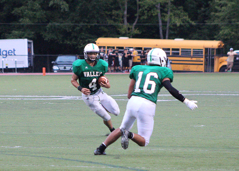 Senior running backJack Jankowsky (4) running with the ball against River Dell. Jankowsky finished the game with 69 yards on the ground and fumble recovery.