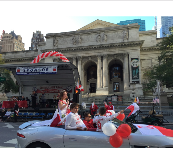 Nicole Misterek waves at the spectators of the parade. 