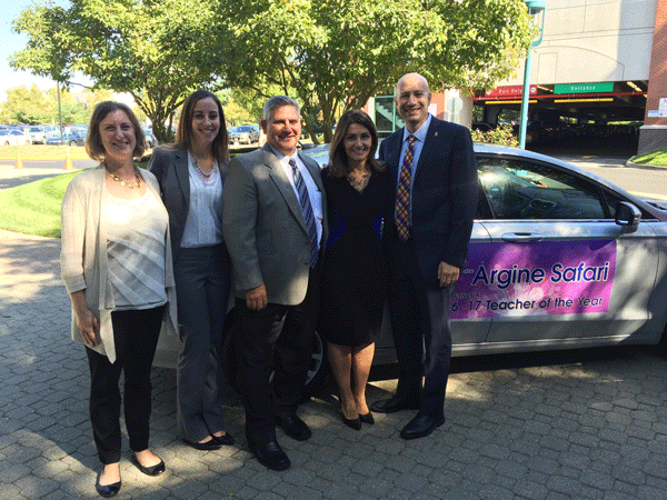 Argine Safari and members of the Pascack Valley Regional District in front of Safaris brand new Ford Fusion. (From left to right: Pascack Hills history teacher Deb Horn, District World Languages and Music Departments supervisor Noemi Rodriguez, Pascack Valley Principal Tom DeMaio, Safari, and District Director of Curriculum, Assessment, and Instruction Barry Bachenheimer)