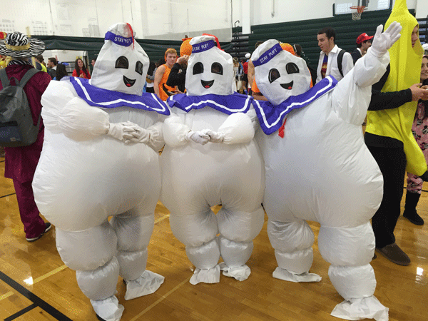 Jodie Hoffman, Shannon Geraghty, and Jennie McCabe dress up as Stay Puft Marshmallow Man from the Ghostbusters.