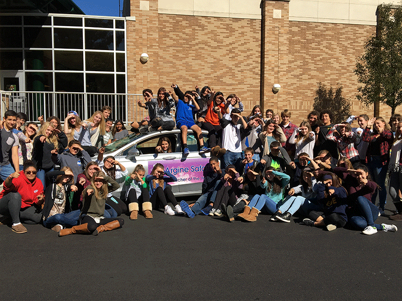 PV choir director Mrs. Argine Safari poses with her students and her new car after being appointed as the New Jersey Teacher of the Year.