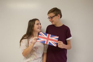 Bethany and Adam Giblin share a smile over the Union Jack. They will be moving back to England this summer. 