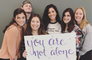 From left, Ashley Evans, Joe Kempka, Ava Prospero, English teacher Ms. Tina Marciano, Kellie Palermo, and Allison Quackenbush show their support for suicide prevention.