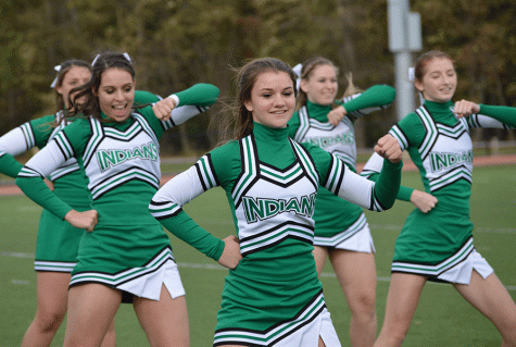 Nicole Raymond and other members of the PV Cheer team perform at a PV football game earlier this year.