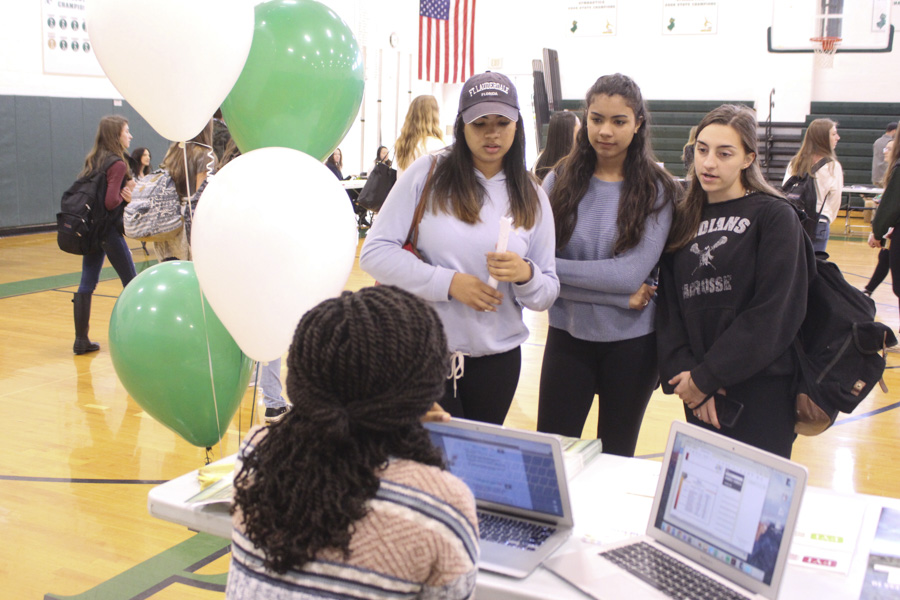 Students explored the different booths, each one highlighting the importance of healthy eating choices and mindfulness as well as various activities that can better one's mental state and overall well-being. Pictured (from left) is Emily DelVillar, Amanda DelVillar, and Cleo Horvath.