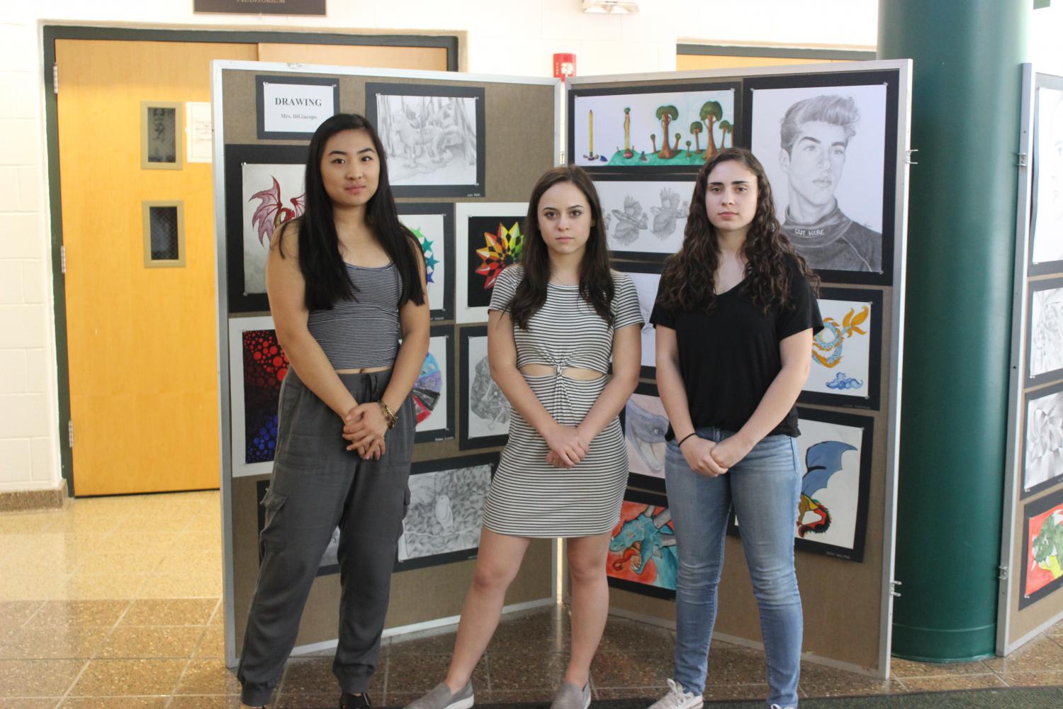 PV seniors and DECA club members Olivia Wang, Mary Kate Viceconte, and Eva Rosini pose together. Many DECA members recently won awards at several competitions.