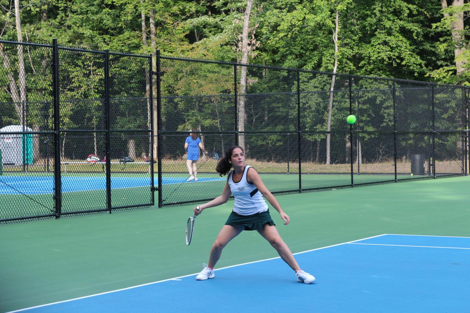 Elizabeth Parisi hits her forehand. The girls tennis team won six matches on this year. 