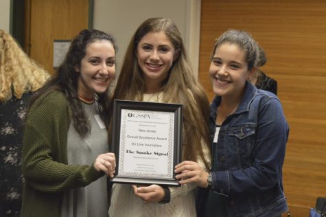 (From left) Kayla Barry, Madison Gallo and Lauren Cohen accept the Overall Excellence Award On Line Journalism award.