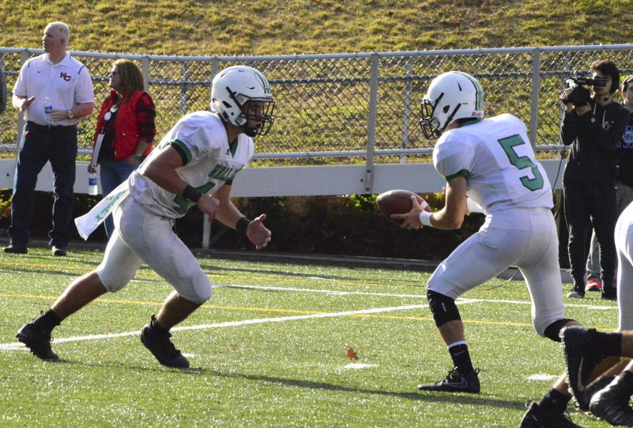 Jake DeMilia (5) hands the  ball off to Jake Williams (44).