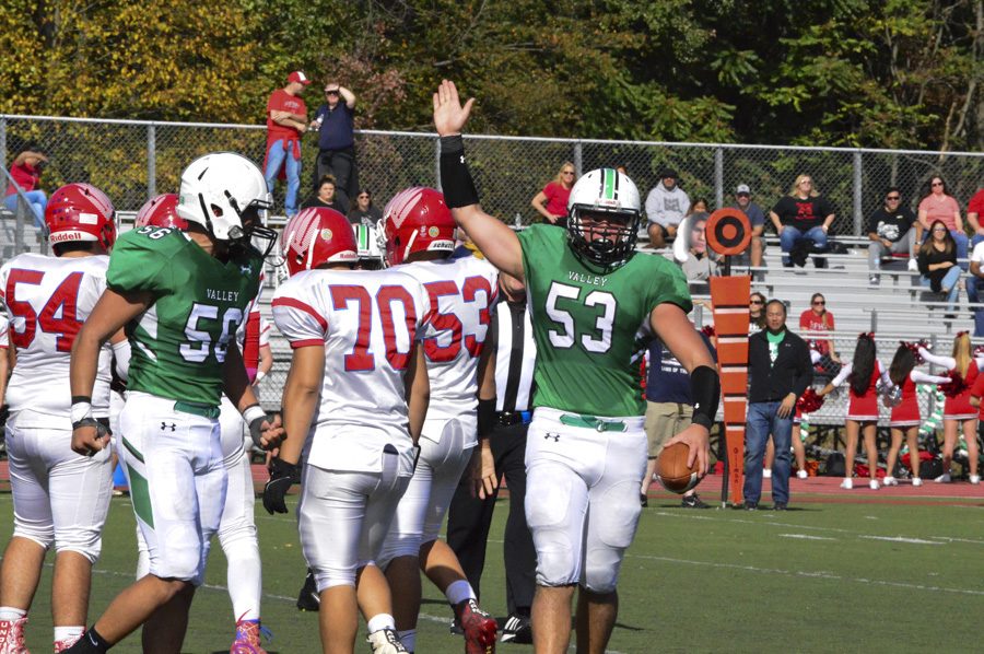 Charlie Looes (53) celebrates after a Ridgefield Park fumble.
