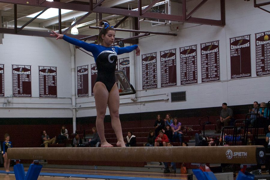 Melissa Ricciardi competes on the beam at the 2017 North 1 Sectionals.