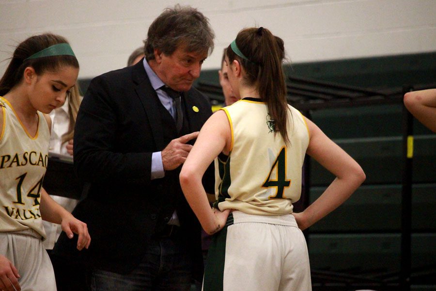 Coach Jeff Jasper gives instructions to Brianna Smith during a break in the action.
