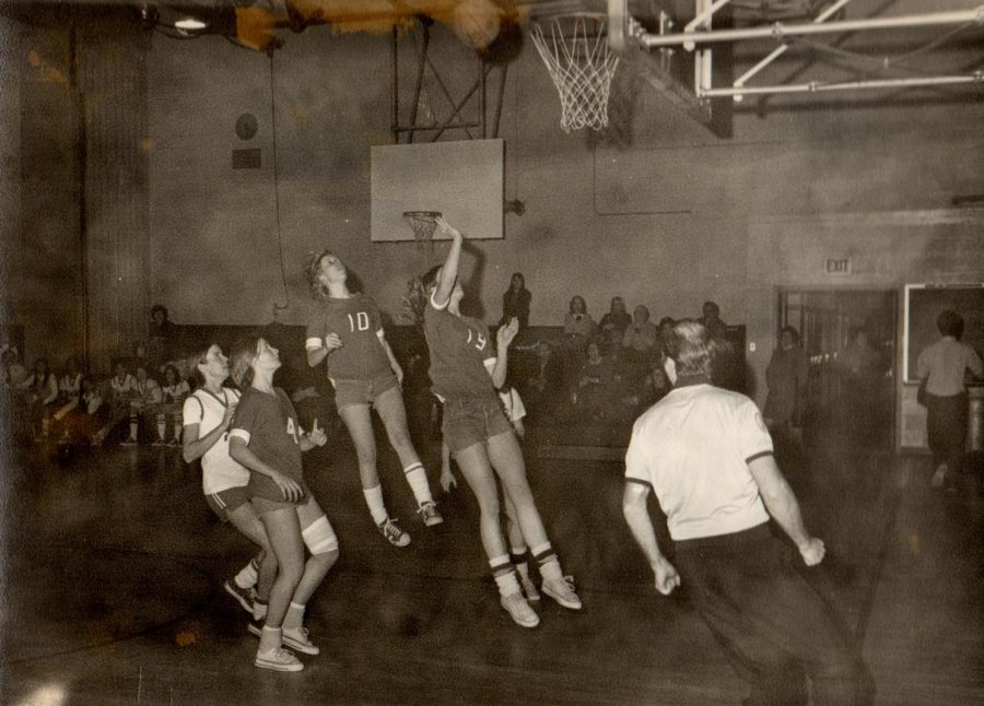 Members of Jasper’s first team play a basketball game in 1973. Their uniforms were cut-off jeans and reversible t-shirts with numbers taped on them.