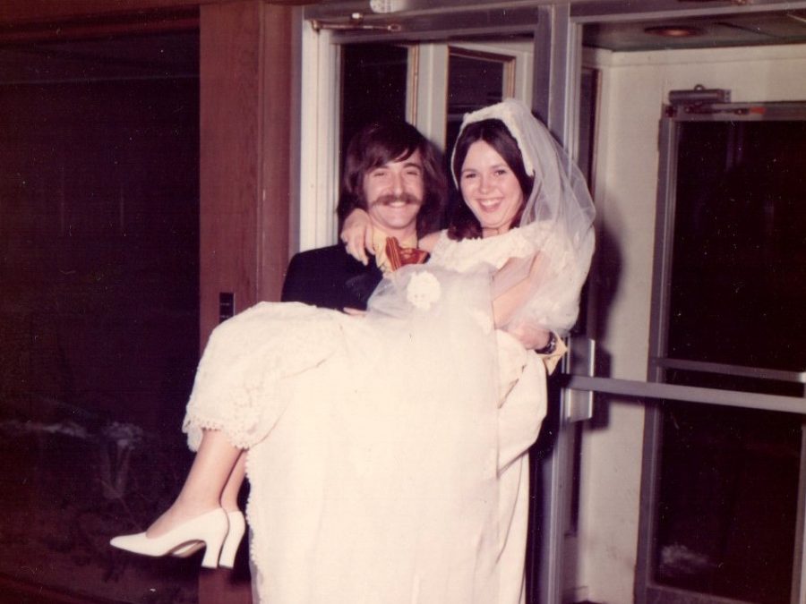 Jeff Jasper carries his bride, Lois Jasper, on their wedding day on March 5, 1972. They have been married for almost 46 years.