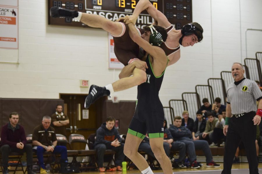 Robbie Natelli (126) wrestles during a dual match against Pascack Hills. Natelli will compete in the district tournament on Saturday.