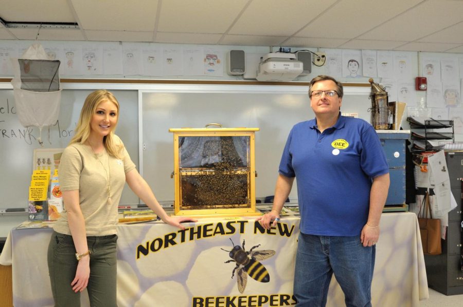 Kristen Lindstrom and Frank Mortimer, the president of the Northeast New Jersey Beekeepers Association, stand in front of a beekeeping display. Pascack Valley, with the assistance of Lindstrom, is currently in the process of becoming a Bee Campus.