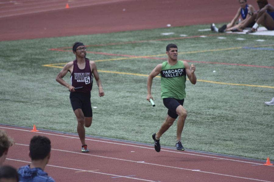 Andrew Martinez runs around the track during a meet. The junior will play a key role for the spring track team. 