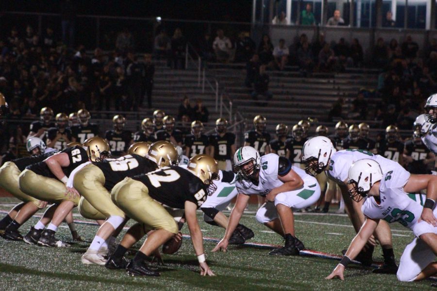 Lineman from both Pascack Valley and River Dell line up and get ready for the snap. The Golden Hawks won by a final of 42-6, ending the Indians' season. 