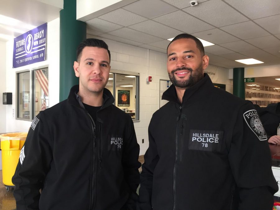 A parting officer, Mike Campereale, stands with Pascack Valleys new student resource officer, German Decena. Decena began working at PV on Dec. 10.