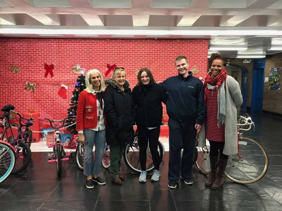 Bailey McNamara, Kirk McNamara, and Peggy Lundquist deliver the donated bikes they collected to Public School Precinct 46 in Harlem, Manhattan on Dec. 12. They recieved a total of 27 bikes to donate to students who are less fortunate.