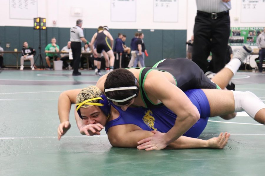 Tommy Chiellini wrestles Sebastian Ferminat during the District Tournament. After advancing to the Region Tournament and now the state tournament, Chiellini, along with teammate Matt Beyer, will return to wrestle in Atlantic City. 