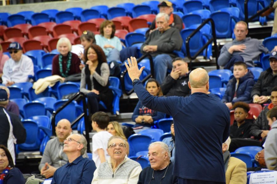 FDU+coach+Greg+Herenda+waves+to+the+fans+that+came+to+support+his+team+on+Sunday.+Herenda+is+a+resident+of+Hillsdale%2C+New+Jersey.+